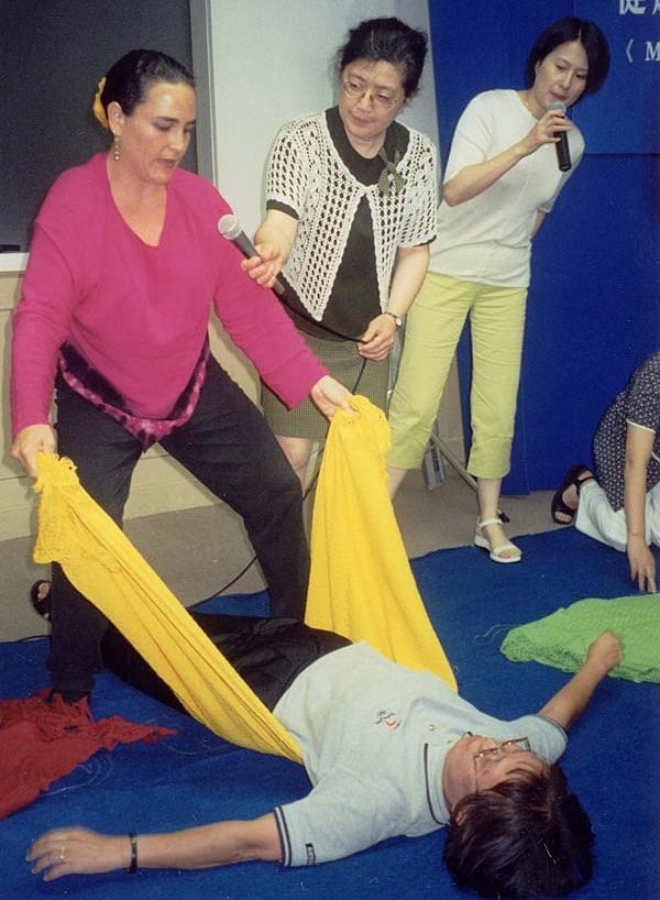 Naoli Vinaver teaching Traditional Rebozo techniques in China, 2005 invited by Midwifery Today.