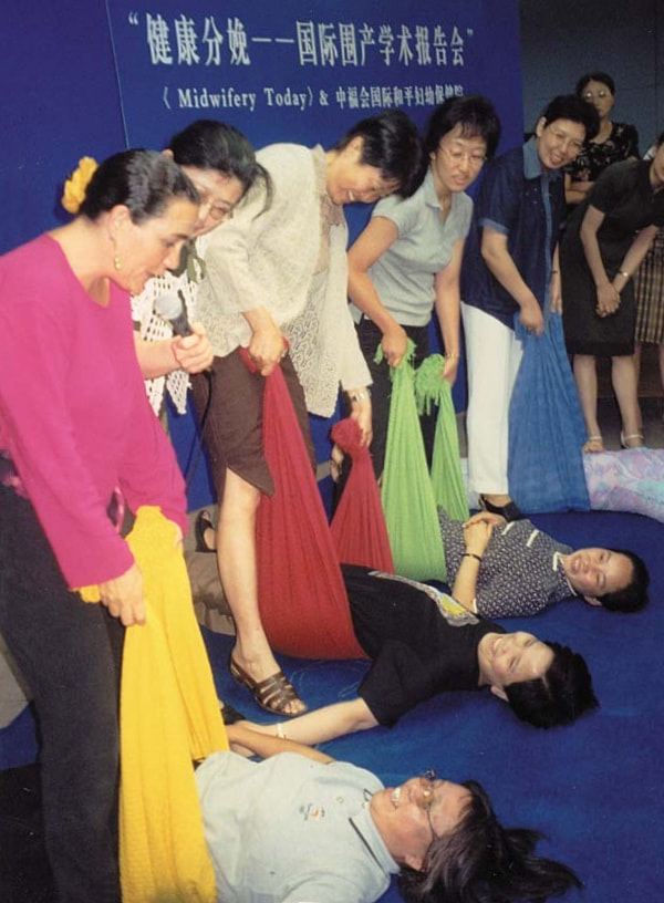 Naoli Vinaver teaching Traditional Rebozo techniques in China, 2005 invited by Midwifery Today.