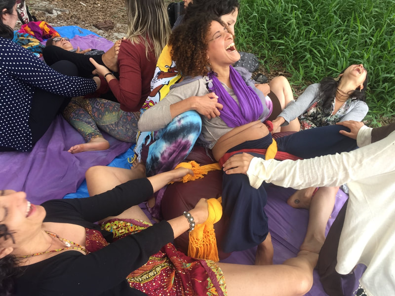 Challenging Births workshop by Naoli Vinaver, practicing Naoli's Rebozo Pelvic Expanding Maneuver in a squatting upright on "Naoli's birth poof" maternal position.