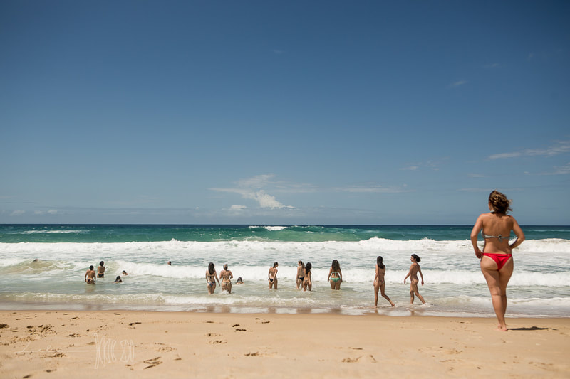 Outdoor class at the beach break during Art of Birth workshop by Naoli Vinaver. Florianopolis, Brazil. Photo by Lela Beltrão.